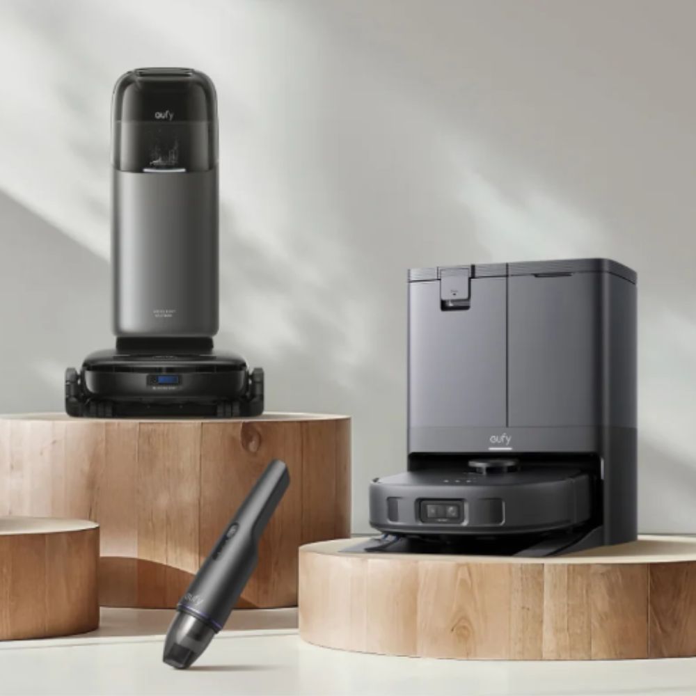 Eufy robot vacuums on pedestals with white background
