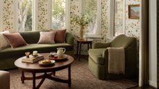 Warm neutral living room featuring moss green furniture and a wooden coffee table