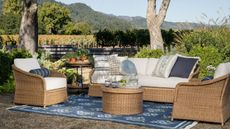 Natural wicker seating and patterned layers styled for the mcgee and co outdoor summer collection for 2026